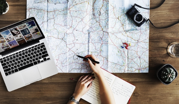 accessible-holidays-enable-holidays-wheelchair-friendly-holidays-five-top-tips-for-stress-free-accessible-holiday-planning-map-laptop-notepad.